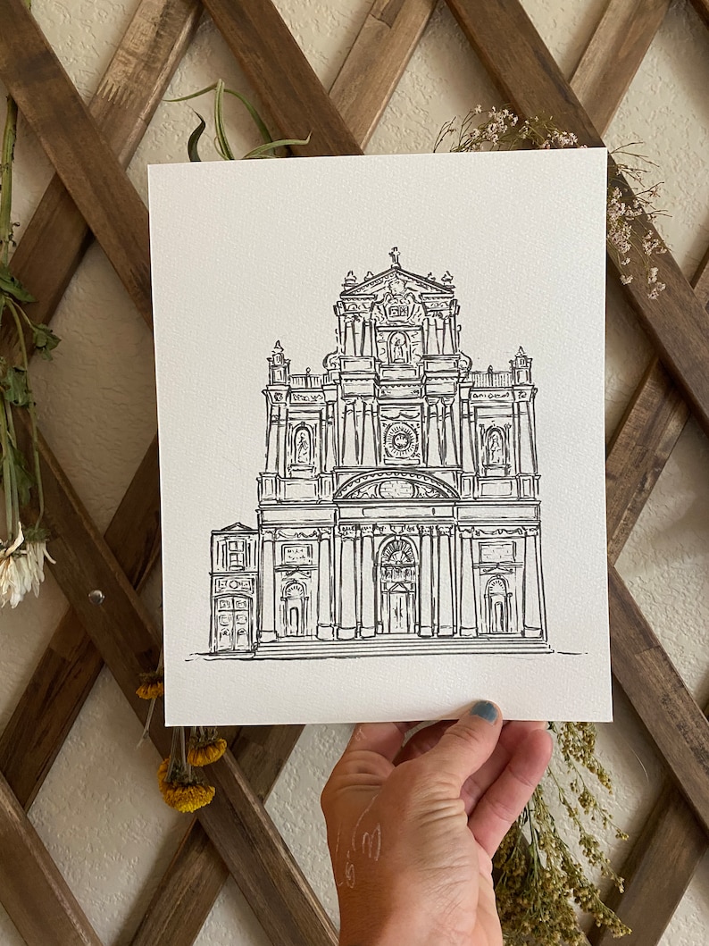 May include: A black and white line drawing of a large church building with a tall steeple and many windows.