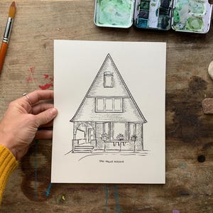 May include: A black and white line drawing of a house with a triangular roof. The house has a porch with a door and windows. The drawing is on a white background and says "304 Cedar Avenue" at the bottom.