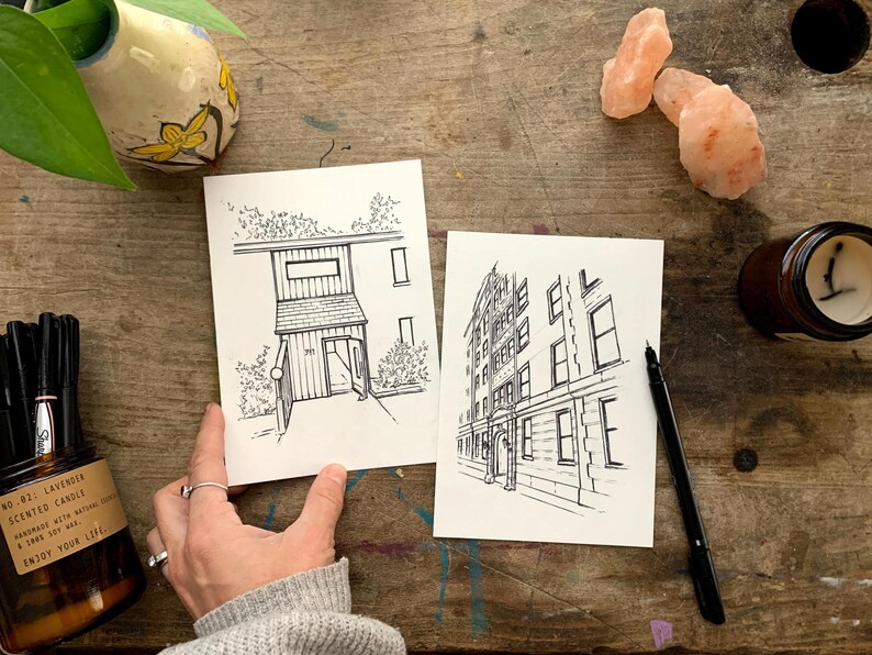 May include: Two black and white line drawings of buildings. The first drawing is of a small building with a door and windows. The second drawing is of a larger building with multiple windows.