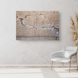 Jewish Kotel Stone Wall Art with colored prayer notes in the slot