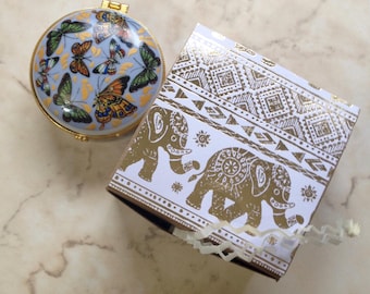 Solid perfume in porcelain box: essential oils in beeswax and cocoa butter