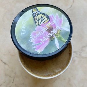 Hair conditioner with herbs and coconut oil for hair strengthening.
