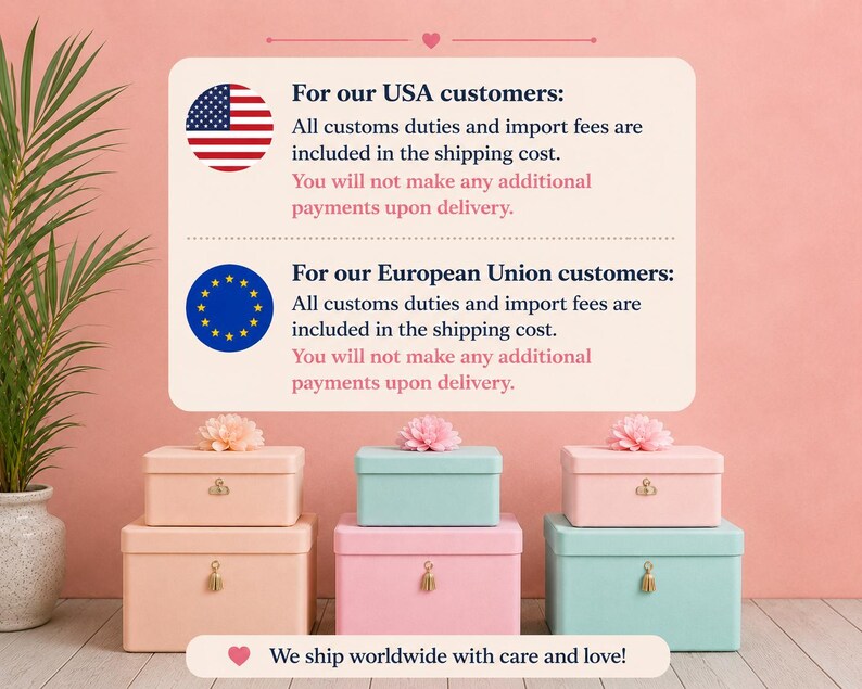 May include: Six rectangular storage boxes arranged in two stacks of three. The boxes are pastel pink and light blue, each featuring a small gold-toned latch and a decorative pink flower on the lid. The boxes sit on a light-coloured wooden surface.
