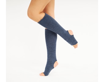 May include: A pair of blue knit leg warmers with a hole at the toe. The leg warmers are made of a soft, stretchy material and are perfect for keeping your legs warm during the colder months.