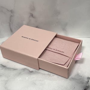 Marina M Jewelry pink gift box with a jewelry pouch, included with every order