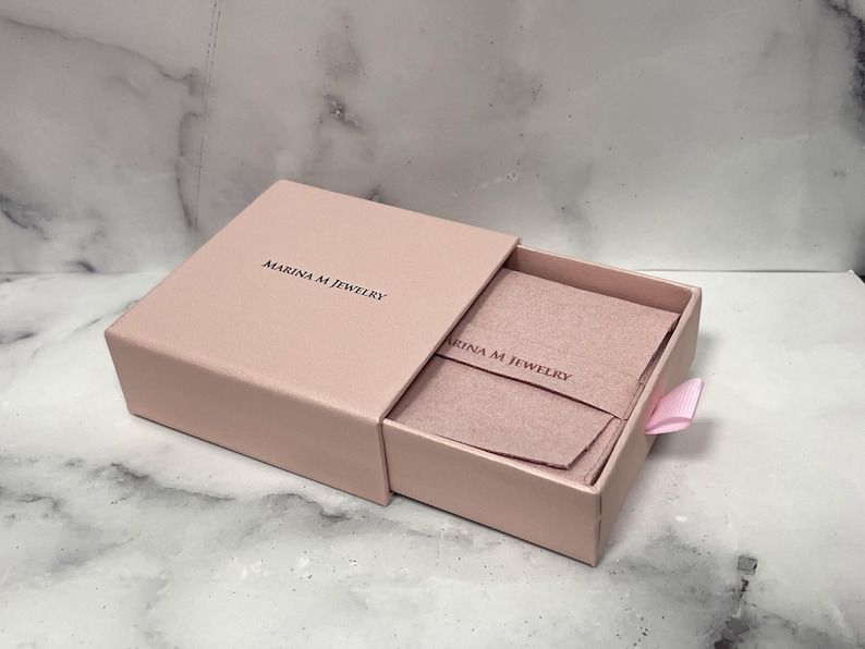 Marina M Jewelry pink gift box with a jewelry pouch, included with every order