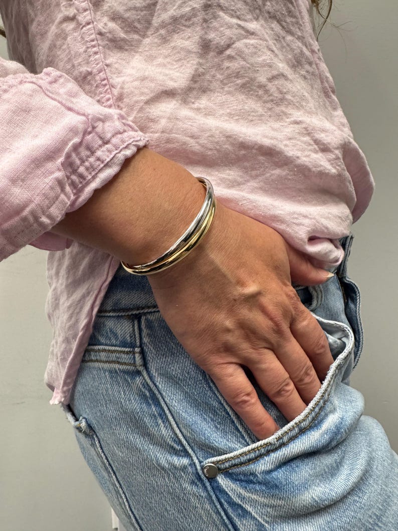 14K Two Tone Gold Double Row crossover Bangle worn on the wrist