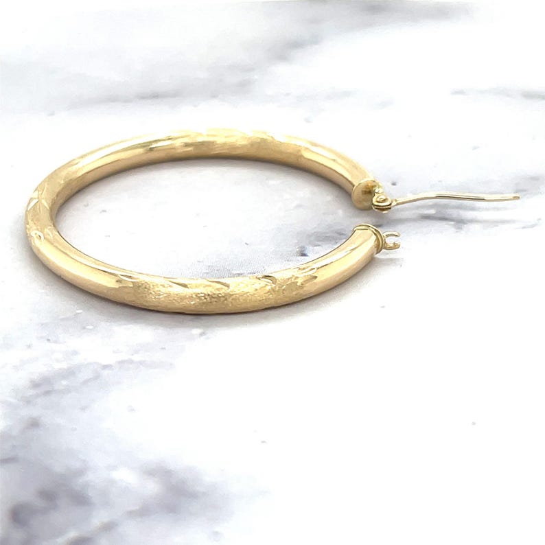 14K Yellow Gold Diamond Cut Textured Design Hoop Earring, side view