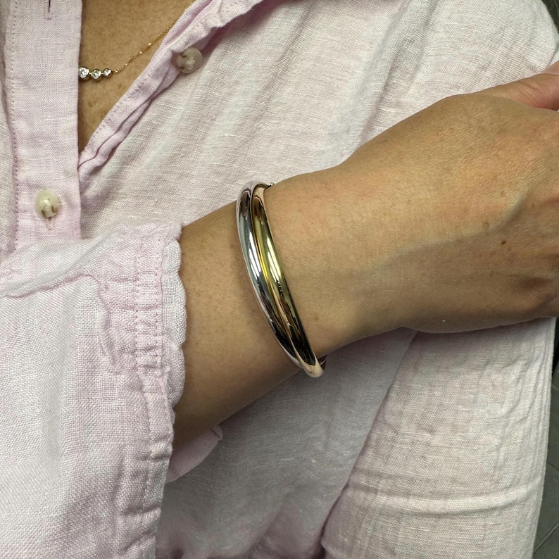 14K Two Tone Gold Double Row crossover Bangle worn on the wrist, another view