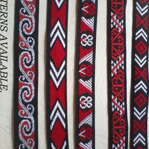 May include: Five different red, white, and black woven ribbon patterns labeled A through E.  The patterns are geometric and include swirls, arrows, and diamonds.
