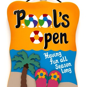 May include: A colorful wooden sign with the words "Pool's Open" and beach-themed graphics. The sign features a beach scene with a palm tree, flip-flops, and the text "Having fun all Season Long."