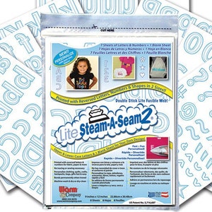 May include: A pack of Lite Steam-A-Seam2 iron-on adhesive for fabric crafts. The pack contains 7 sheets of letters and numbers, 1 blank sheet, and a sheet of shapes. The pack is white with blue text and images. The text on the pack reads "Lite Steam-A-Seam2", "Printed with Reversed Letters, Numbers & Shapes in 2 Sizes", "Double Stick Lite Fusible Web!" and "Upper & Lower Case Letters & 1 Blank Sheet for Your Own Designs".