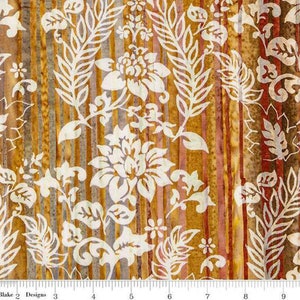May include: White floral pattern on a brown and orange striped background. The fabric has a batik style design.