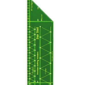 May include: Green plastic quilting ruler with a 45-degree angle and markings for 1/2 inch, 1/4 inch, and 1/8 inch. The ruler is labeled "Duo Tool" and "Precision Quilting Wonders" by Pauline Rogers.
