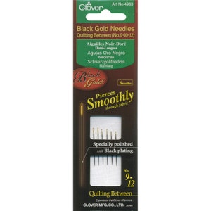 May include: A package of six black gold quilting needles, sizes 9, 10, and 12. The needles are specially polished with black plating and are designed to pierce smoothly through fabric. The package is labeled "Clover Black Gold Needles Quilting Between (No. 9-10-12)".