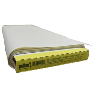 May include: A roll of beige Pellon Decovil Light one-sided fusible stabilizer for crafts and home decor. The packaging is yellow with black text, including the product name, width of 17 inches, and length of 10 yards.
