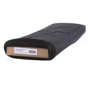 May include: A roll of black fabric, likely for sewing or crafting, is displayed on a white background. The fabric is tightly rolled and appears to be a solid color. The label on the cardboard core reads "STAPLE SEWING ADS".