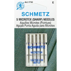 May include: A package of 5 Schmetz Microtex (Sharp) sewing machine needles. The needles are in a clear plastic case with a blue label that says "Schmetz Microtex" and "130/705 H-M 80/12".