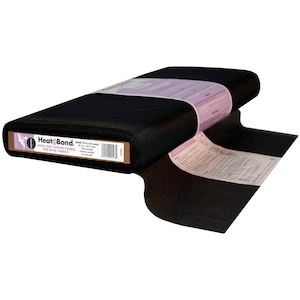 May include: A bolt of black HeatnBond Ultra Soft Woven Fusible for batik fabrics. The label states 19 inches by 25 yards, 100% polyester, machine washable, and dry cleanable. The fabric is rolled and secured with a light purple and white paper band.