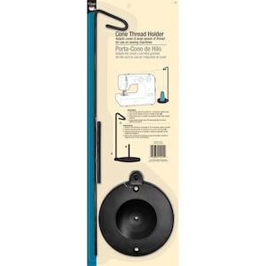 May include: A black cone thread holder for sewing machines. The packaging includes the text "Cone Thread Holder" and "Porta-Cono de Hilo". The holder adapts cones and large spools of thread.