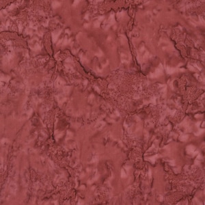 May include: A close-up of a red fabric with a marbled pattern. The fabric has a subtle texture and a deep, rich red color.