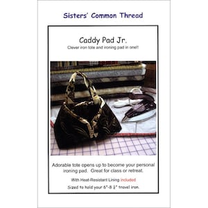 May include: A black and gold patterned tote bag with a matching handle, designed to open into an ironing pad. The text on the image reads "Caddy Pad Jr." and "Sisters' Common Thread". Includes a heat-resistant lining and is sized for a 6"-8" travel iron.