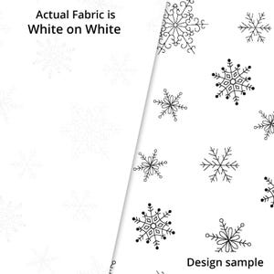 以下が含まれることがあります： 雪の結晶模様の白い生地サンプル。白い背景に黒い雪の結晶がデザインされています。「Actual Fabric is White on White」と「Design sample」の文字も表示されています。