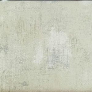 Puede incluir: Primer plano de una tela texturizada verde claro con un sutil patrón de líneas blancas y grises.