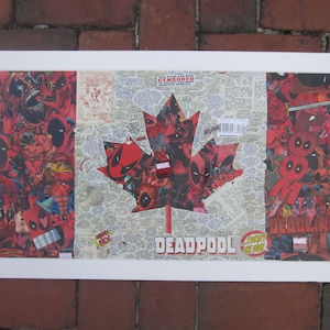 May include: A framed collage of comic book images featuring the superhero Deadpool. The collage is in the shape of a Canadian maple leaf and includes the text "DEADPOOL" and "I THOUGHT I GOT AWAY".