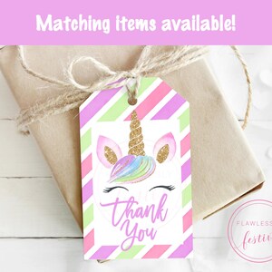 May include: A pink, green, and purple striped gift tag with a unicorn illustration and the text "Thank You".