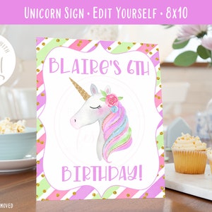 May include: A printable 8x10 inch sign featuring a unicorn with a rainbow mane and a pink flower crown. The sign says "BLAIRE'S 6TH BIRTHDAY!" and has a pink, green, and gold striped background.