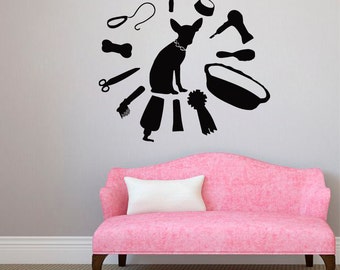 May include: Black and white silhouette of a dog with grooming tools and a bath tub surrounding it. The dog is wearing a collar with a tag. The image is on a white wall with a pink sofa in the foreground.