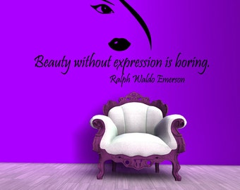 May include: A purple wall with a black and white silhouette of a woman's face and the quote "Beauty without expression is boring. Ralph Waldo Emerson". A purple armchair sits in front of the wall.