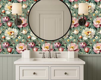 May include: A bathroom featuring a white vanity unit, a round black mirror, and floral wallpaper. The wallpaper displays large pink and white peonies on a green backdrop. Two sconces with beige shades are positioned either side of the mirror.