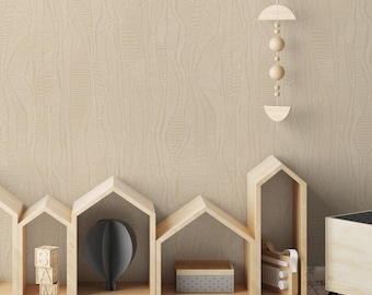 May include: A light beige wallpaper with vertical wavy lines and textured patterns, featuring wooden house-shaped shelves, wooden alphabet blocks, a hanging wooden mobile, and a gray rug with black stars on the floor.