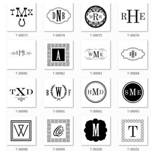 May include: A grid of 12 black and white monogram designs. Each design features a different combination of letters and symbols, such as a horseshoe, a wreath, and a Greek key border. The designs are arranged in a grid with a white background.
