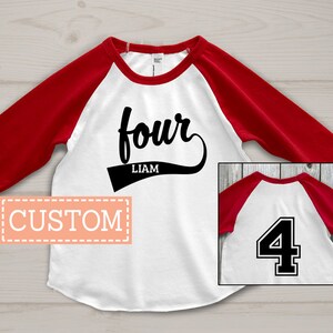 May include: A white and red baseball-style shirt with the word "four" in a script font and the name "Liam" below it. The shirt has red sleeves and a white body. A small image shows the number "4" on the back.