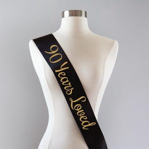 90 Years Loved Sash | 90th Birthday Sash 90th Birthday Party 90 and Fabulous 90th Birthday Gift Idea for Women Custom Sash 90th Anniversary Black/Gold Glitte