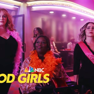 May include: Three women in a dimly lit bar, wearing party attire. The woman in the center is wearing an orange feather boa and a brown patterned dress. The woman on the left is wearing a pink feather boa and a black dress. The woman on the right is wearing a black dress with a pink sash that says "Bride to be" and a tiara. The text "GOOD GIRLS" is in yellow letters on a black background in the foreground of the image. The NBC logo is in the lower left corner of the image.