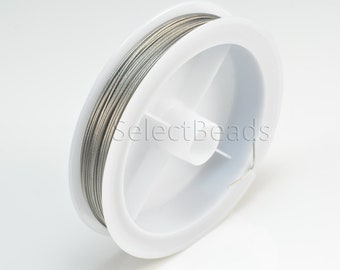 May include: A spool of silver-colored wire on a white plastic spool. The spool has a label that says "SelectBeads".