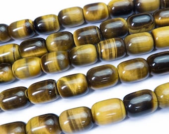 May include: A strand of tiger's eye beads, with a golden brown color and a subtle sheen. The beads are oval shaped and have a smooth, polished finish.