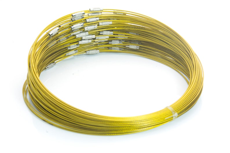 May include: A bundle of gold-colored metal wire, coiled into a circle. The wire is thin and flexible, and it is likely used for jewelry making or other crafts.
