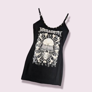 May include: Black sleeveless tank top with a skull and crossbones graphic and the text "Megadeth Thirteen".