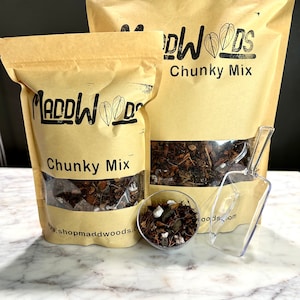 May include: Two brown paper bags with the text "Maddwoods Chunky Mix" printed on them. The bags contain a brown chunky mix. A clear plastic scoop is next to the bags.
