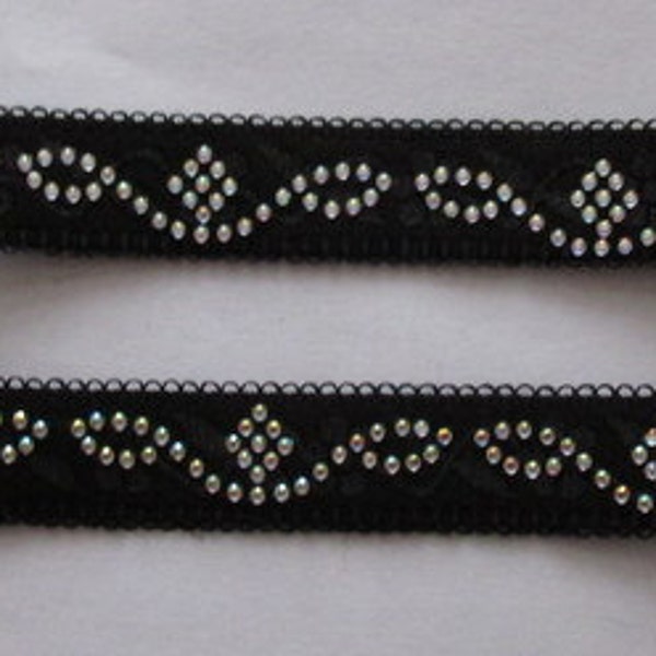 Black wiggly bra strap embellished with tiny jewels. Will jazz up outfit - will not give support