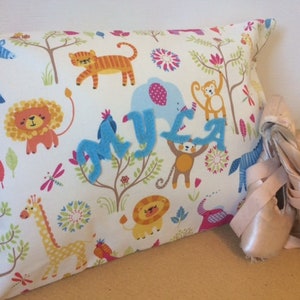 Cushion cover, pillow case, personalised in safari animal fabric. Envelope style.