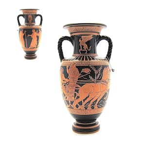 May include: Two black and orange Greek amphora vases with black handles and intricate designs. The vase on the left has a scene of three figures, while the vase on the right has a scene of a chariot race.