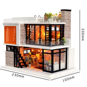 May include: A miniature dollhouse model of a modern two-story house with a white exterior, black windows, and a stone facade. The house has a balcony, a rooftop terrace, and a small pool. The dollhouse is 230 mm wide, 200 mm tall, and 100 mm deep.