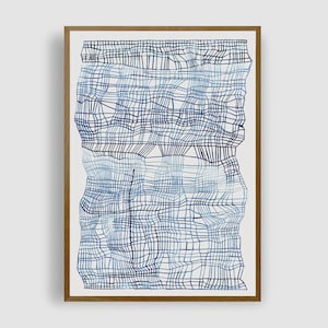 May include: A framed abstract art print featuring a blue and white geometric pattern. The pattern is made up of overlapping lines and squares, creating a textured effect.