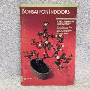 May include: A magazine cover featuring a bonsai tree with white flowers in a black pot. The cover title is "Bonsai for Indoors" and the magazine is "Plants & Gardens, Brooklyn Botanic Garden Record".